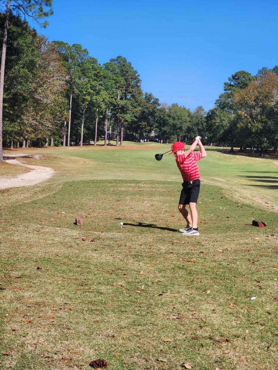 Carter Peacock, the big swinging lefty hits a 300 yard drive. 